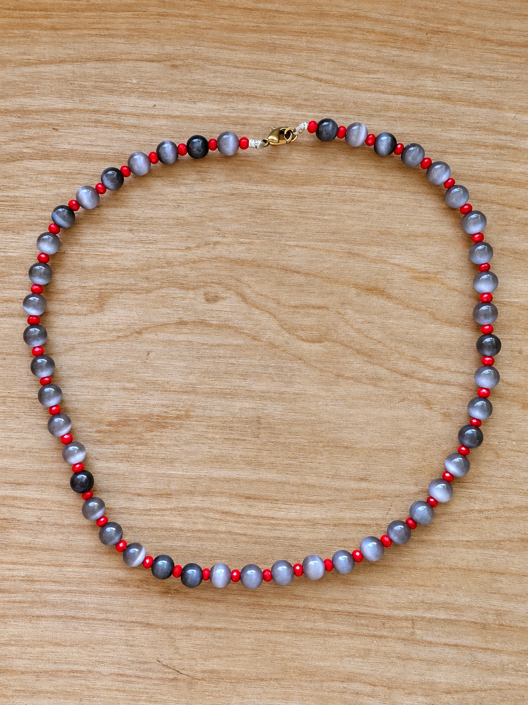 Handmade Gray Cat’s Eye Beaded Necklace with Red Crystal Accents