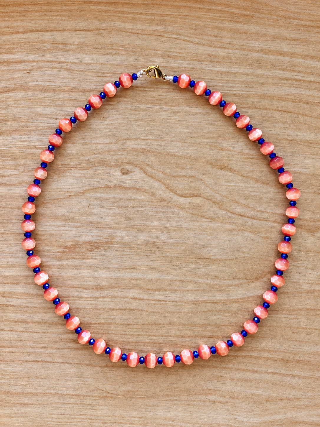 Handmade Coral Orange Beaded Necklace with Royal Blue Accents