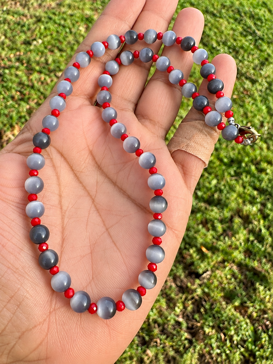 Handmade Gray Cat’s Eye Beaded Necklace with Red Crystal Accents