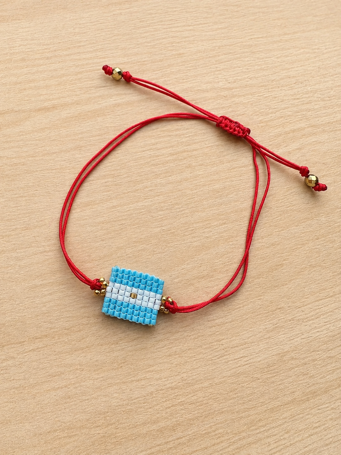 Handmade Argentina Flag Beaded Bracelet – Adjustable Red Cord Friendship Bracelet